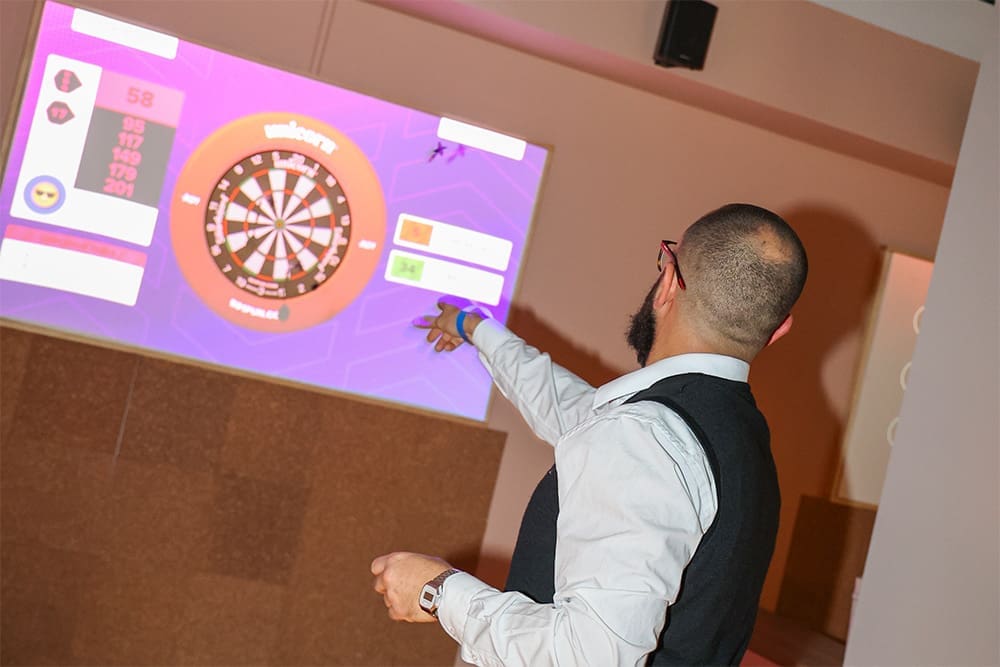 man throwind dart at send it! social club