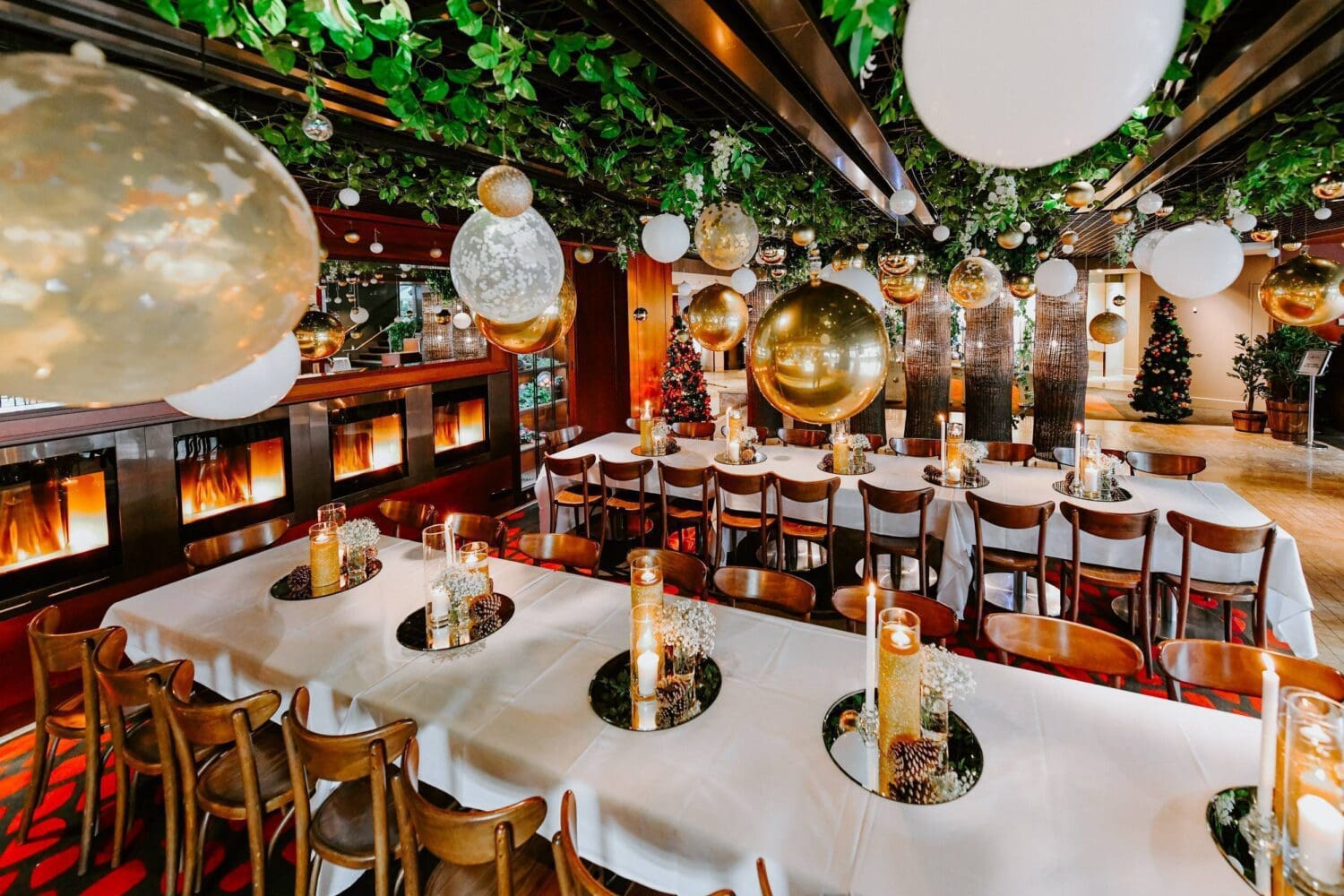 Christmas setup of The Flame for private function, room filled wit h white and gold balloons