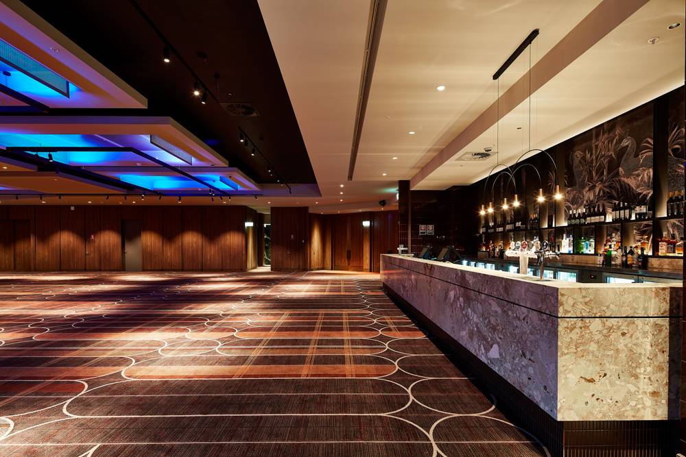 Wide angle shot of the new Showroom showing the bar, and front door